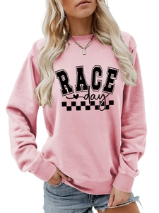 Detail of pink race day sweatshirt featuring ribbed cuffs and a round neckline