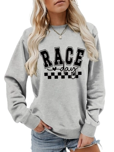 Close-up of Race Day graphic sweatshirt with checkered flags and premium cotton texture