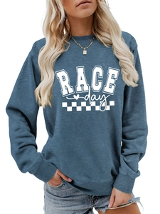 Close-up of Race Day letter print and racing flag detail on blue athletic sweatshirt