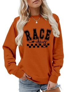 Detail of orange long sleeve sweatshirt featuring Race Day text and checkered pattern