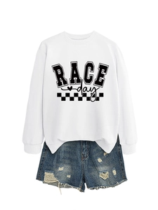 Close-up of a white sweatshirt featuring black RACE DAY text and checkered flag design