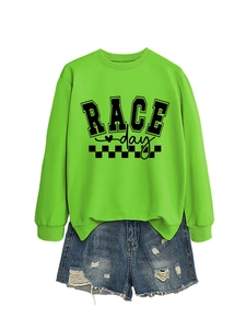 Close-up of neon green crewneck sweatshirt with black RACE DAY print and ribbed cuff details