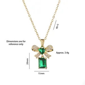 Titanium steel bow necklace with green gemstone pendant on white background