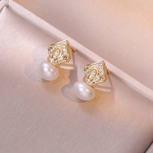 Elegant gold crown stud earrings with sparkling white zircons and fresh water pearls
