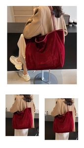 Close-up of burgundy velvet tote bag with exterior pocket and slim shoulder straps