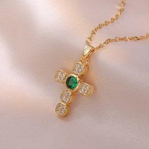 French style gold cross necklace with emerald green gemstone and micro-pave crystals