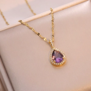 Golden titanium necklace with purple teardrop gemstone and white zircon accents