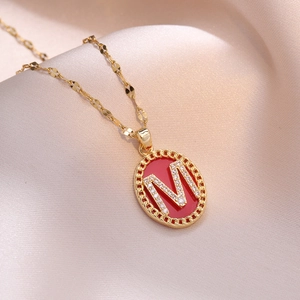 Chinese style gold necklace with M-letter pendant and micro-set diamonds on red enamel background