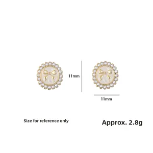 Detail shot of vintage bow pearl stud earrings showing 11mm size and 2.8g weight