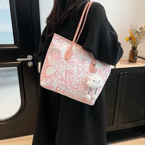 Pink graffiti canvas tote bag for women featuring cute heart and cat illustrations