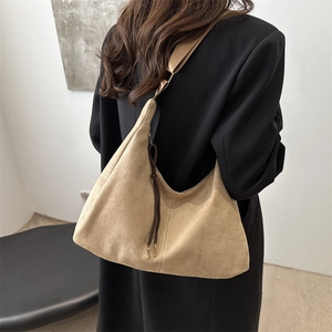 Large khaki suede tote bag for women showing a retro minimalist shoulder style