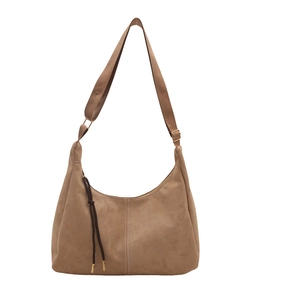 Brown suede half-moon shoulder bag with adjustable strap and decorative tassel
