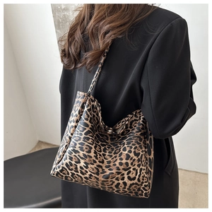 Detail of large leopard print tote bag in premium faux leather with dual shoulder straps