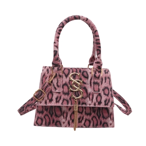 Fashionable leopard print crossbody bag with gold SS logo and metallic fringe details