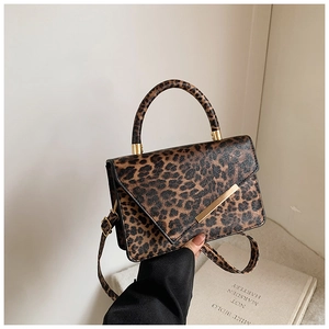 Chic leopard print handbag with golden metal trim and adjustable crossbody strap