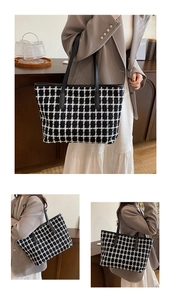 Detail shot of black and white checkered tote bag with slender leather shoulder straps