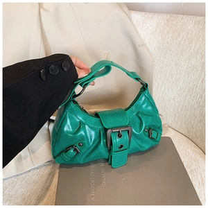 Detail of green wrinkled PU leather shoulder bag featuring vintage silver metal buckle