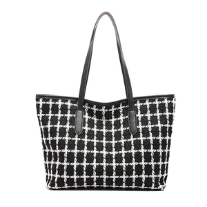Elegant black and white tweed tote bag with black leather handles for women stylish style
