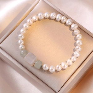 Elegant S925 freshwater pearl bracelet with square jade stones on a beige satin gift box