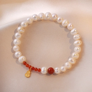 Elegant S925 sterling silver pearl bracelet with red agate and golden gourd charm
