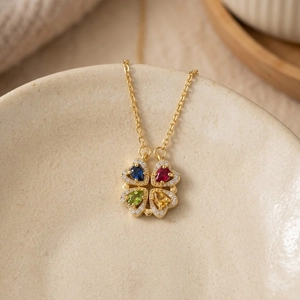Four-leaf clover necklace with colorful heart-shaped gems and sparkling diamonds