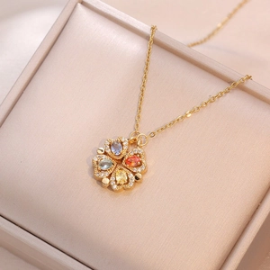 Golden clover necklace with four colorful heart-shaped gemstones and white zircon accents