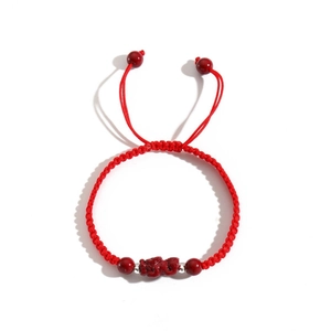 Hand-woven red rope bracelet with PiXiu charm and adjustable knot for luck