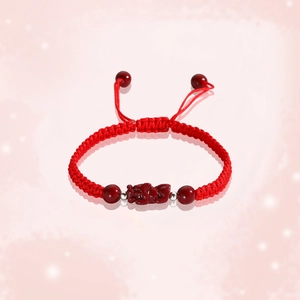 Handcrafted red string bracelet with cinnabar Pi Xiu charm and adjustable braided knot