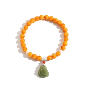 Natural amber beaded bracelet with a green Buddha pendant and minimalist stone details