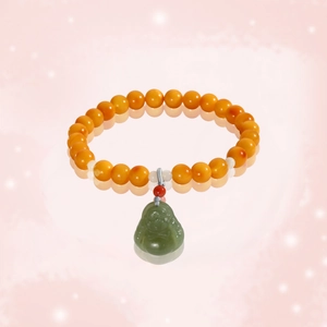 Natural amber and nephrite jade beaded bracelet with a green Buddha pendant for women