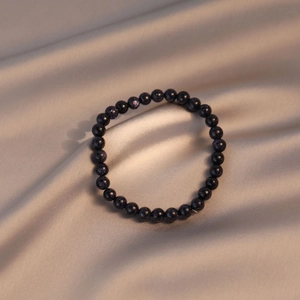 Blue goldstone beaded bracelet for women on champagne silk fabric with starry sparkles