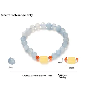Detailed view of 8mm aquamarine beaded bracelet with amber accent and 18cm circumference