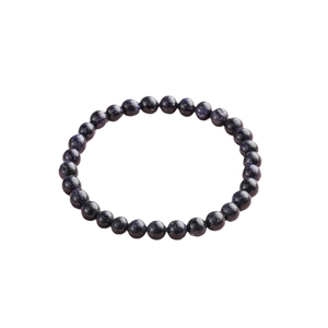 Starry blue goldstone beaded bracelet with shimmering glitter effect on white background