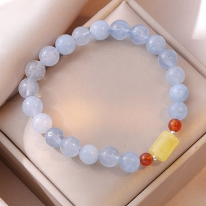Natural aquamarine beaded bracelet with amber accent on soft beige silk jewelry box