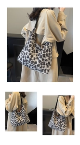 Three-way view of a large leopard print faux fur tote bag with black leather shoulder strap