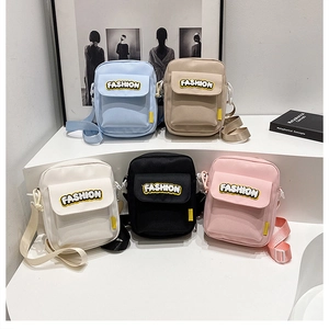 Five assorted colors of large capacity canvas crossbody bags with Fashion embroidery patches