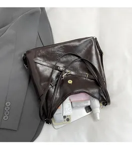 Deep brown vintage leather tote bag interior showing large capacity for daily essentials