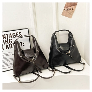 Retro tote bag in black and dark brown faux leather shown in two colors side by side