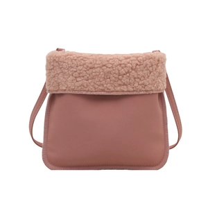 Pink faux suede bucket bag with soft fleece flap and adjustable shoulder strap for women