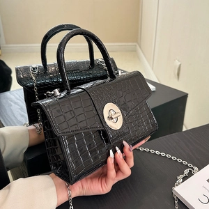 Glossy black crocodile pattern handbag with silver chain strap and metal swivel lock