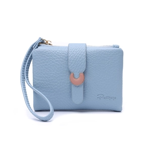 Close-up of light blue litchi pattern leather wallet with rose gold horseshoe buckle