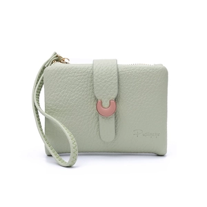 Detail of light green litchi texture leather wallet with wristlet and rose gold buckle