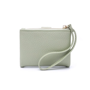 Light green minimalist pebbled leather wallet with gold zipper and hand strap