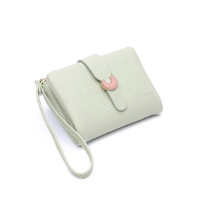 Detail shot of mint green lychee grain leather wallet with pink U-shaped metal buckle