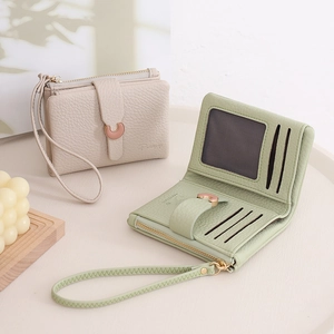 Detailed view of women's litchi pattern wallets showing card slots and wrist straps
