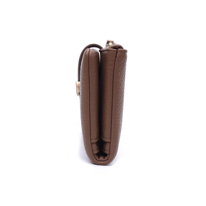 Side view of brown lychee grain leather wallet showing multi-layer accordion structure