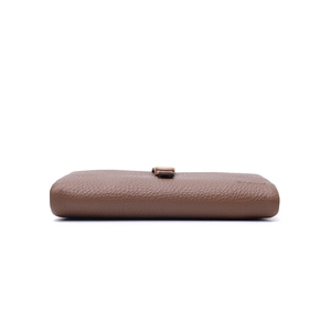 Detailed side view of brown pebble grain leather wallet with metal buckle and logo
