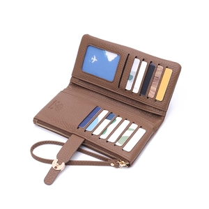 Detailed interior of long brown leather wallet with multi-card slots and zipper pouch
