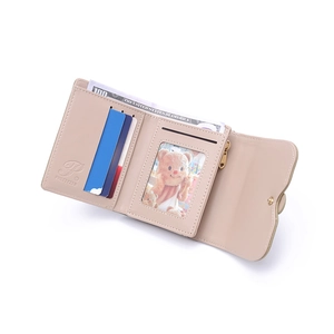 Detail showing internal card slots, photo window and bill compartment of the pink wallet