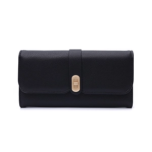 Detail of black lychee grain leather wallet with golden oval LUCKY twist lock